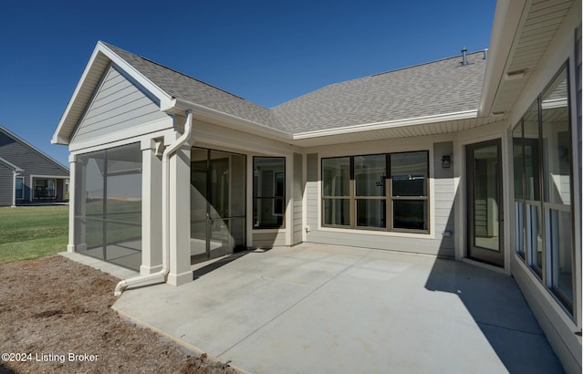 17105 Farrier Dr, Louisville, KY 40245 - back of property featuring a sunroom, a patio, and roof with shingles