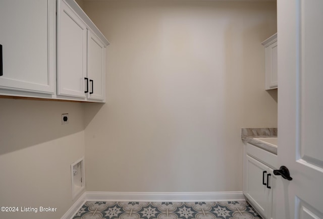 laundry room with cabinets and electric dryer hookup