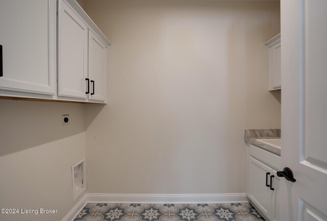 17105 Farrier Dr, Louisville, KY 40245 - laundry room with baseboards, hookup for an electric dryer, tile patterned flooring, and cabinet space