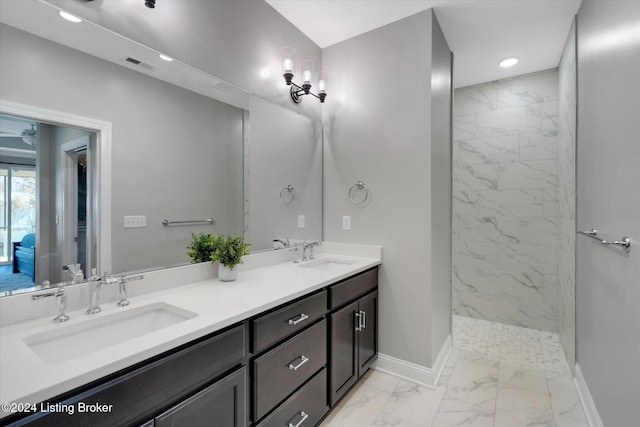 bathroom featuring vanity and a tile shower