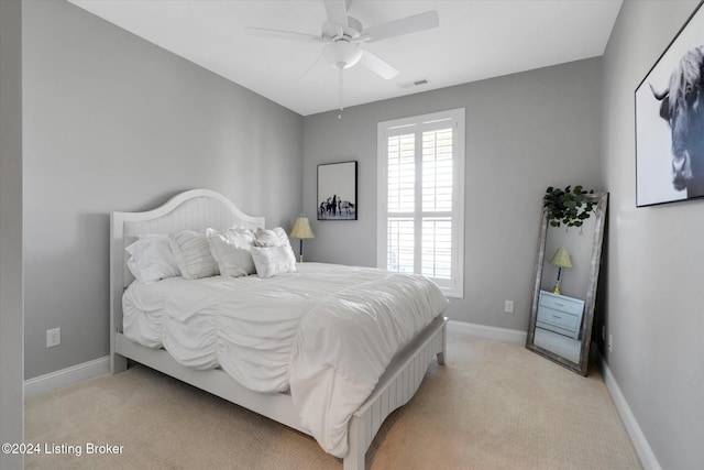 carpeted bedroom featuring ceiling fan