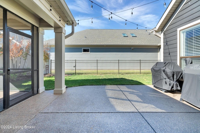 view of patio featuring a grill