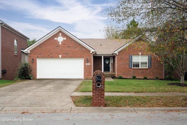 view of front of house with a garage and a front lawn