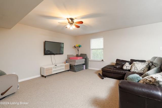 living room featuring carpet floors and ceiling fan