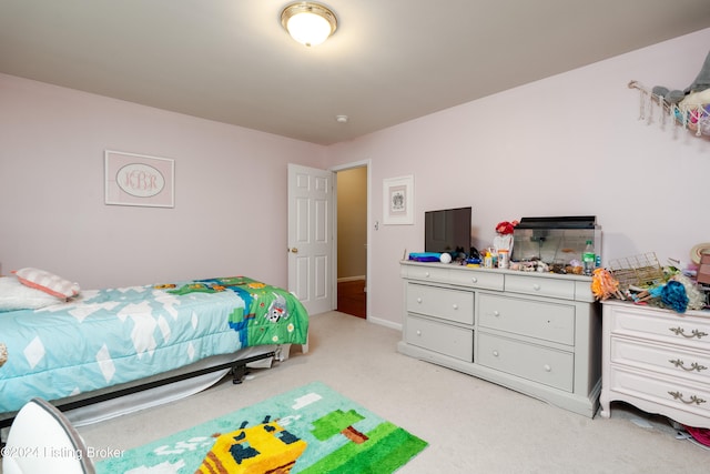 bedroom with light colored carpet