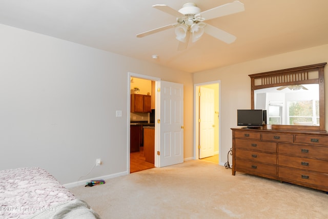 bedroom with light carpet and ceiling fan