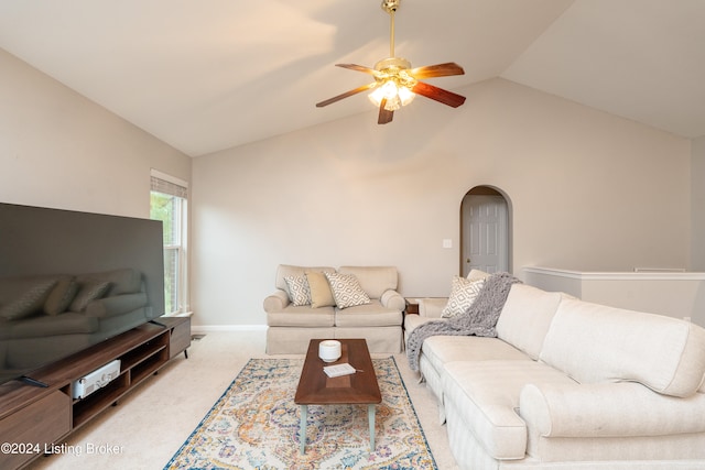 living room featuring ceiling fan, light colored carpet, and vaulted ceiling