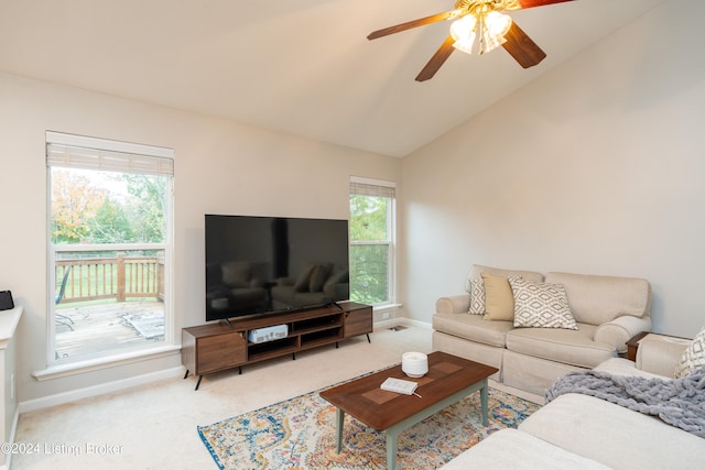 carpeted living room with ceiling fan, lofted ceiling, and a healthy amount of sunlight