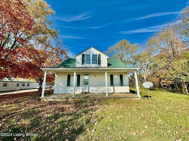 view of front facade with covered porch and a front lawn