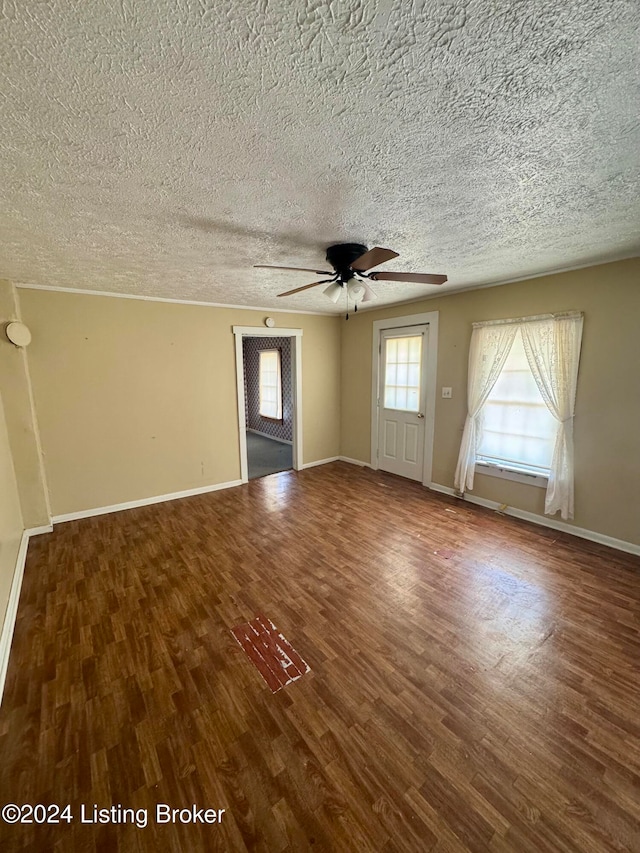 unfurnished room featuring hardwood / wood-style floors, a textured ceiling, and ceiling fan