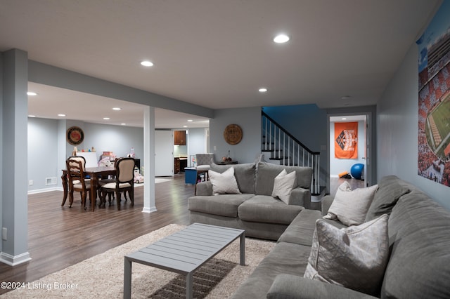 living room featuring dark wood-type flooring