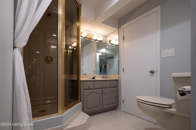 bathroom featuring a shower with curtain, vanity, and tile patterned flooring