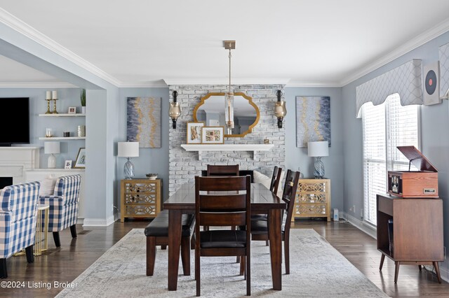 dining space with crown molding and dark wood-type flooring