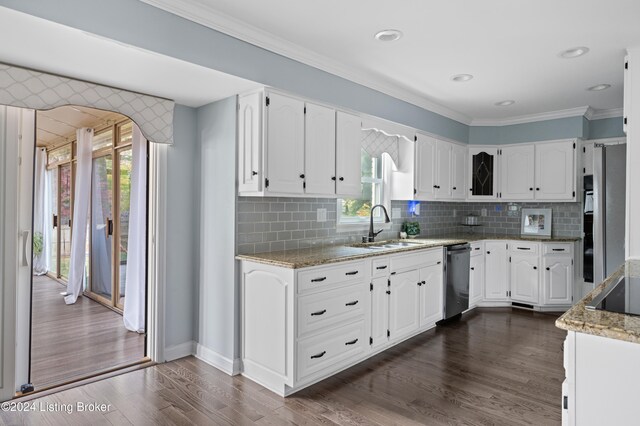 kitchen with dark hardwood / wood-style floors, dishwasher, sink, white cabinets, and light stone counters