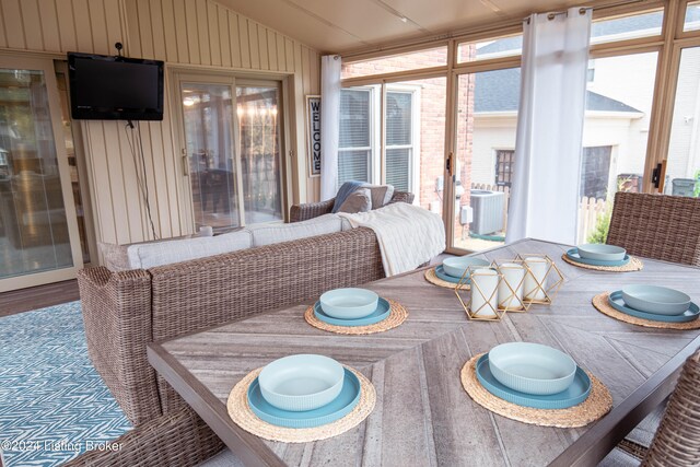 sunroom / solarium with lofted ceiling