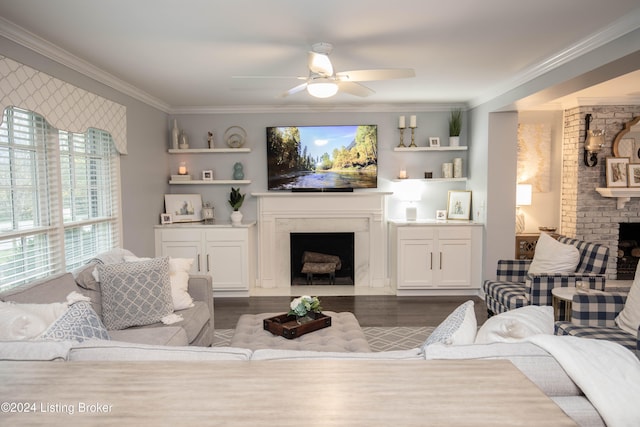 living room with dark hardwood / wood-style floors, ceiling fan, and ornamental molding