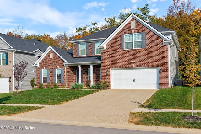 view of front of home featuring a front lawn and a garage