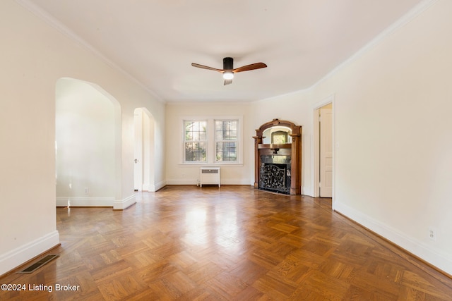 unfurnished living room featuring parquet flooring, crown molding, and ceiling fan