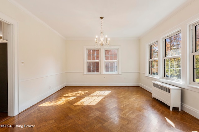 unfurnished dining area featuring crown molding, parquet floors, radiator heating unit, and an inviting chandelier