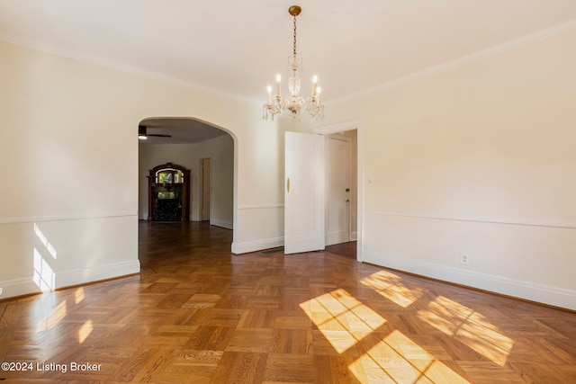 unfurnished room featuring ornamental molding, ceiling fan with notable chandelier, and dark parquet flooring