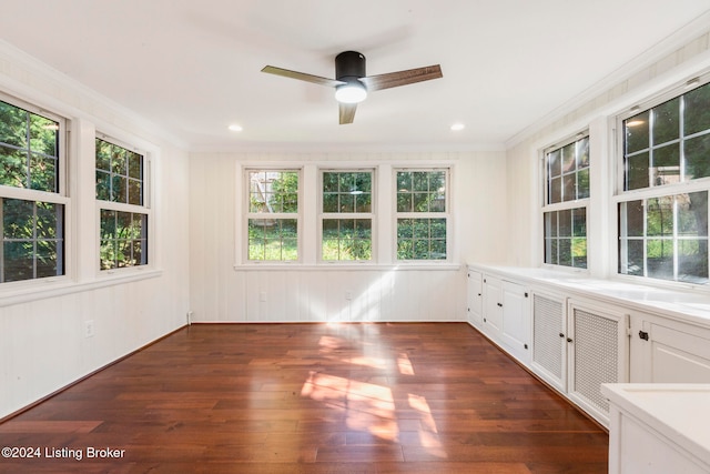 unfurnished sunroom featuring ceiling fan