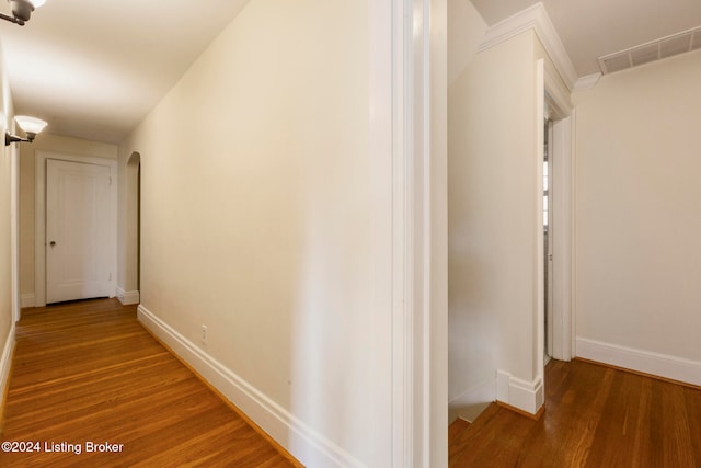 hall with hardwood / wood-style flooring