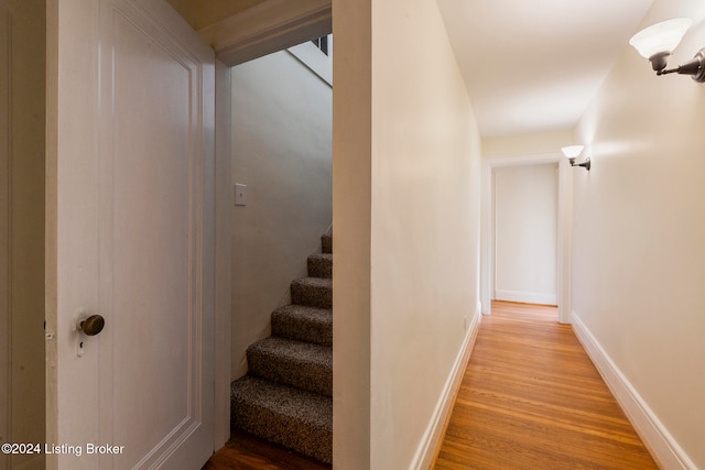 stairs with hardwood / wood-style floors