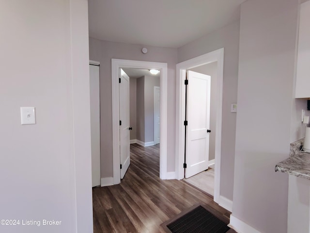 hall featuring dark wood-type flooring