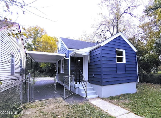 bungalow-style home with a carport