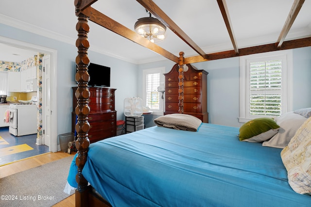 bedroom featuring ornamental molding, an inviting chandelier, hardwood / wood-style floors, and beamed ceiling