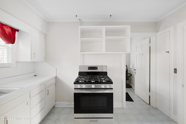 kitchen with crown molding, white cabinets, and stainless steel range with gas stovetop