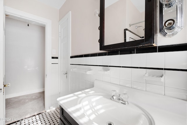 bathroom with vanity, tile walls, and tile patterned flooring