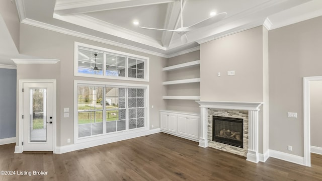 unfurnished living room featuring a fireplace, crown molding, and dark hardwood / wood-style flooring