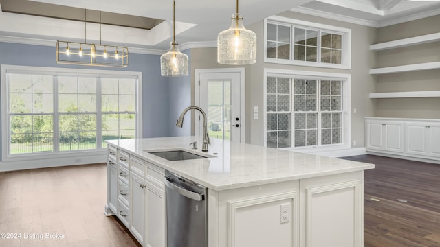 kitchen featuring dishwasher, dark wood-type flooring, a center island with sink, sink, and light stone countertops