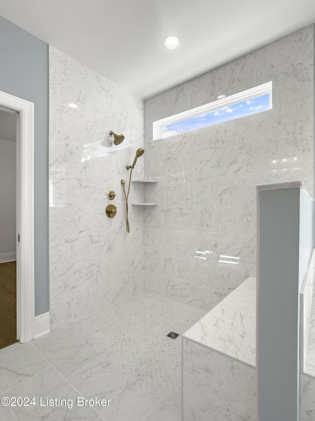 bathroom featuring a tile shower