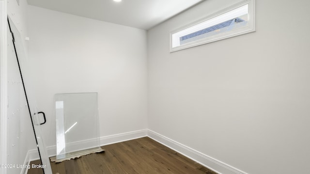 laundry room featuring dark hardwood / wood-style flooring