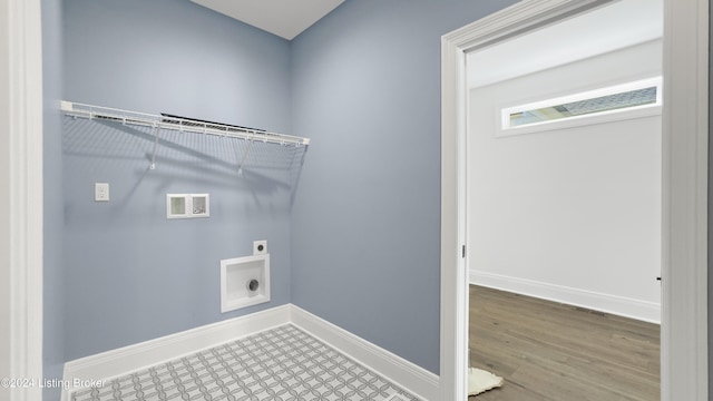 laundry area featuring hookup for an electric dryer, hardwood / wood-style flooring, and hookup for a washing machine