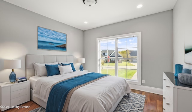 bedroom featuring dark hardwood / wood-style flooring