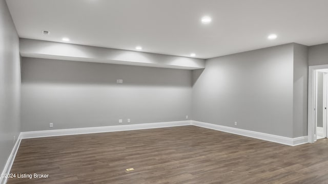 basement featuring dark hardwood / wood-style floors