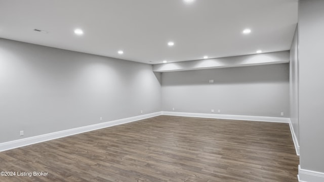 spare room with dark hardwood / wood-style floors