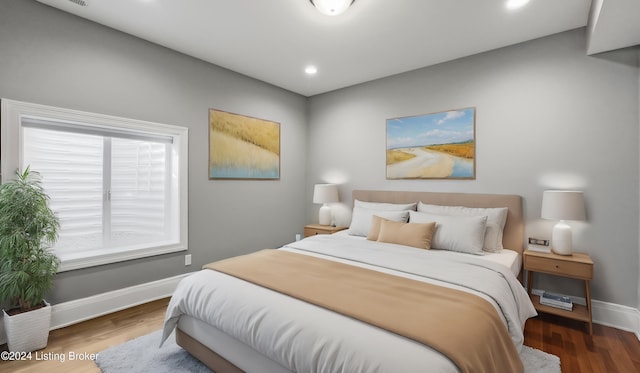 bedroom with wood-type flooring