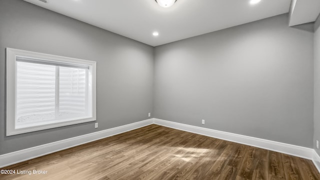 spare room featuring hardwood / wood-style floors