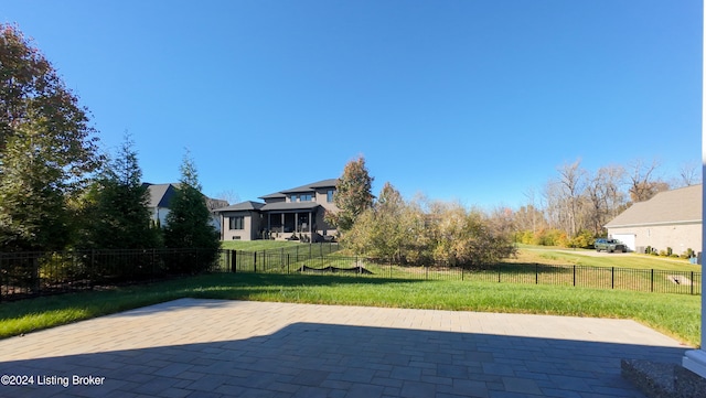 view of pool featuring a patio and a lawn