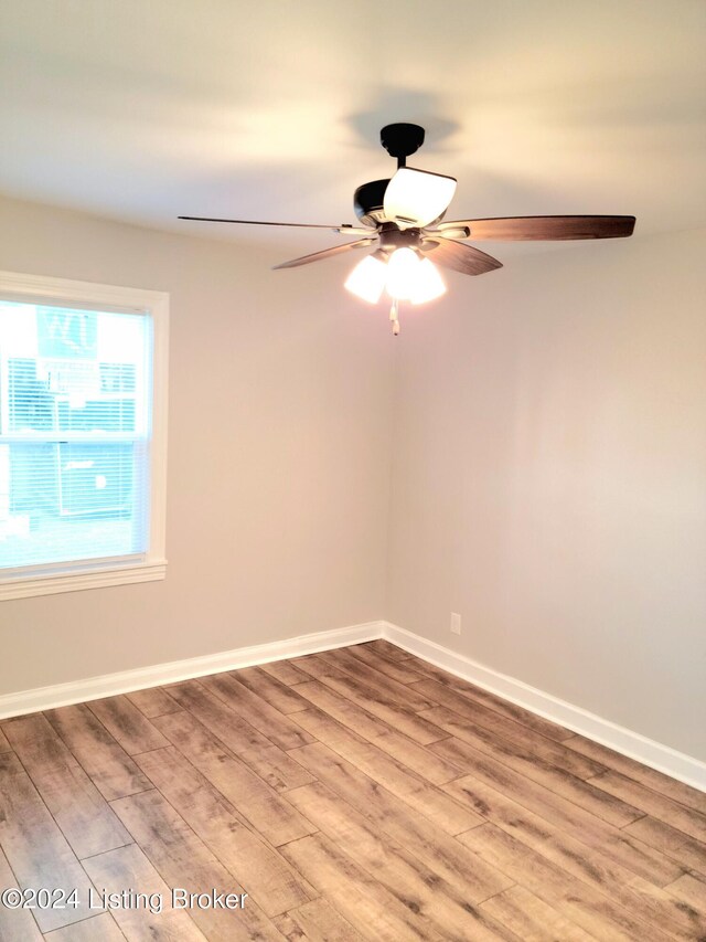 spare room with ceiling fan and hardwood / wood-style floors