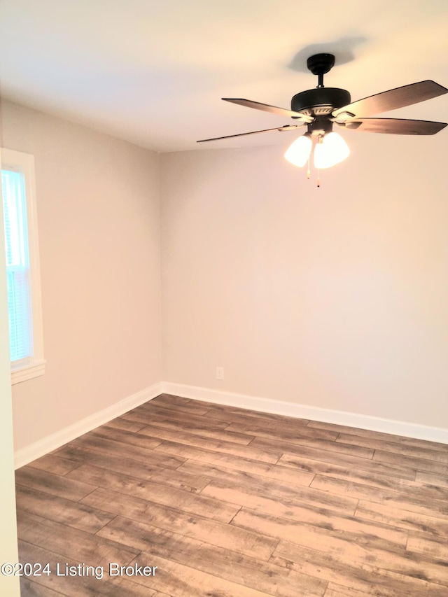 unfurnished room with wood-type flooring and ceiling fan