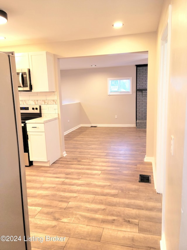 hallway featuring light hardwood / wood-style floors