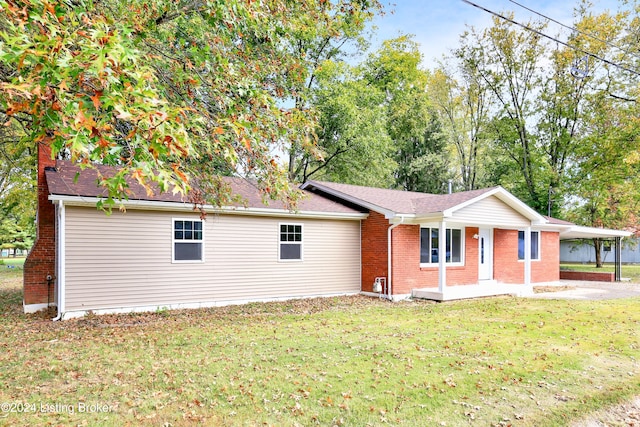 ranch-style house with a front lawn