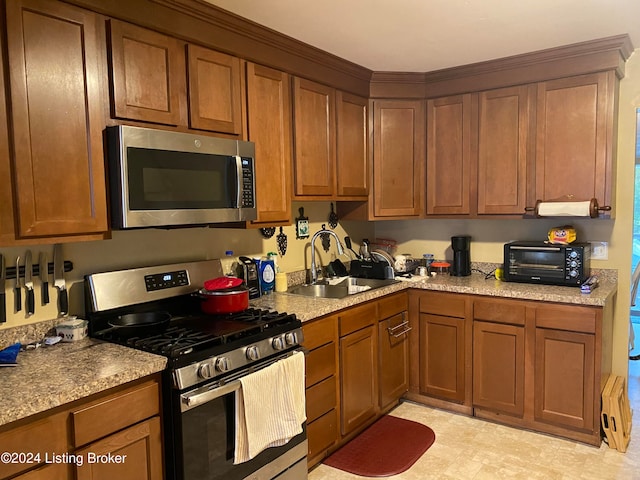 kitchen featuring appliances with stainless steel finishes and sink