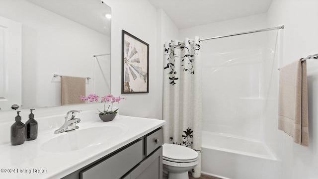 full bathroom featuring toilet, vanity, and shower / bath combination with curtain