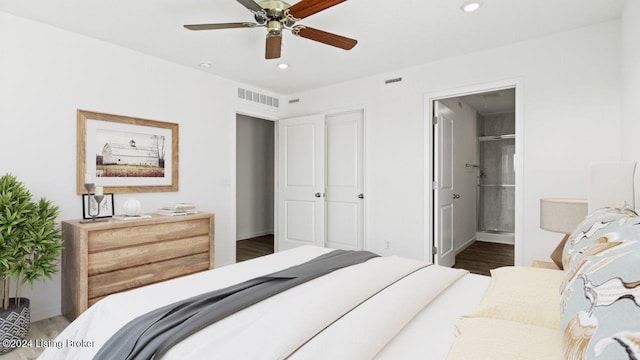 bedroom with connected bathroom, ceiling fan, a closet, and dark hardwood / wood-style floors